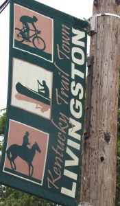 A banner reads Kentucky Trail Town Livingston. The signs help mark trails in Livingston, Kentucky, building tourism in Rockcastle county