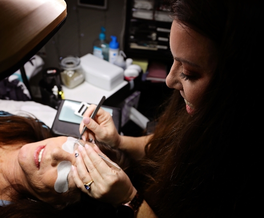 esthetician providing an eye service