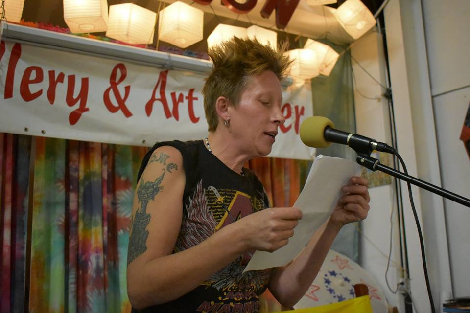 English professor, open mic organizer, and US Marine Brew Wilson-Battles reading at one of the first poetry slams in Grayson kentucky