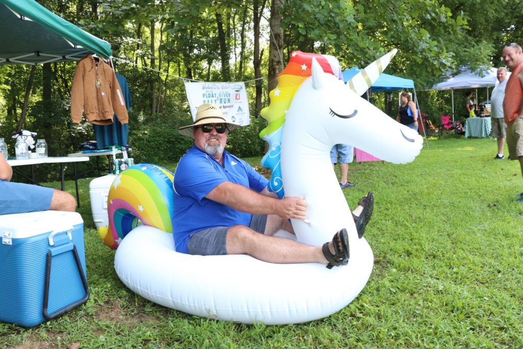 A man sits inside a unicorn float at an event in estill county kentucky. the irvine-ravenna area is now a trail town full of hiking and more.