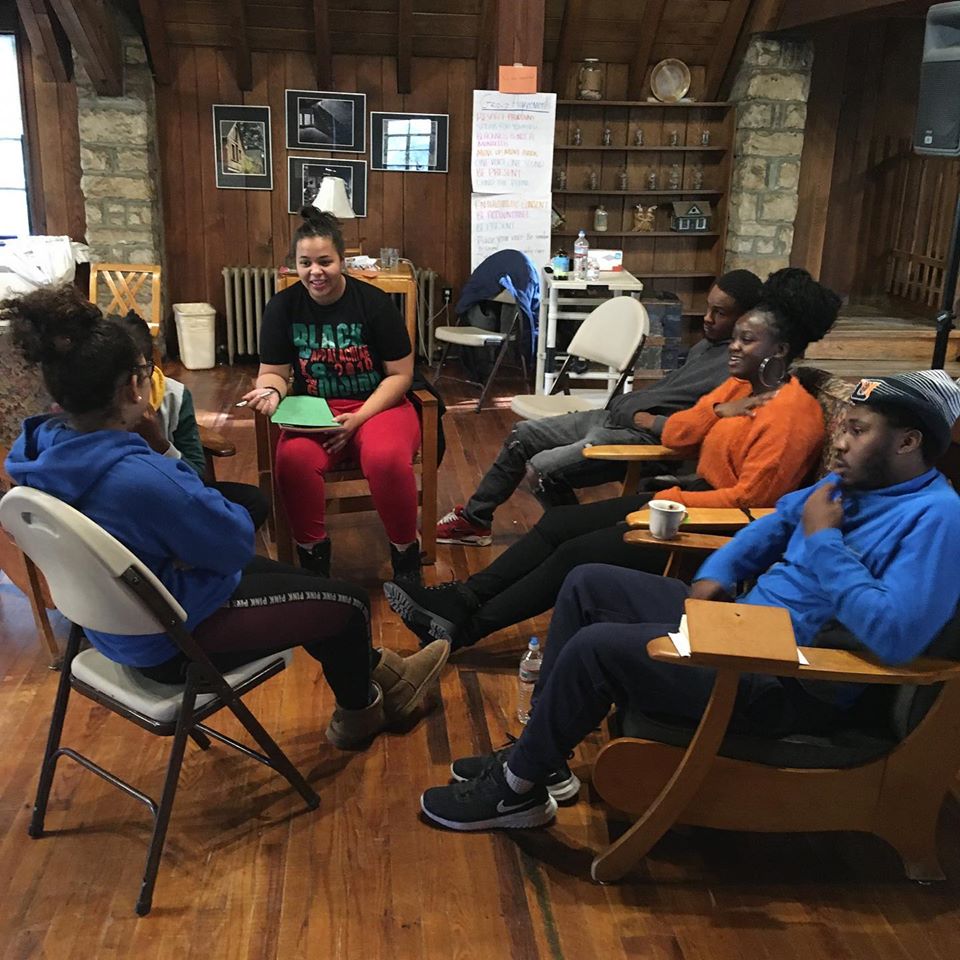 A small group of young Black appalachians at the gathering discusses change making in Appalachia for african americans. 