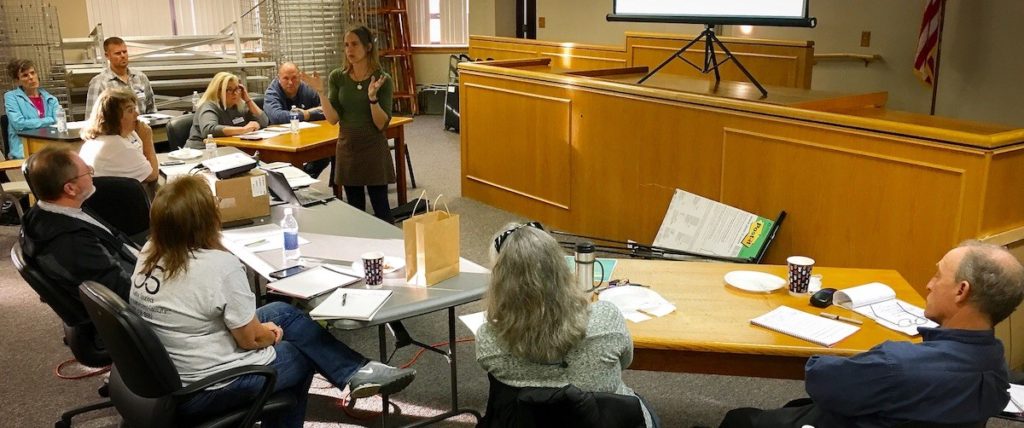 A group of participants it at tables at the Airbnb workshop in McKee, Kentucky. MACED is expanding Eastern Kentucky tourism 