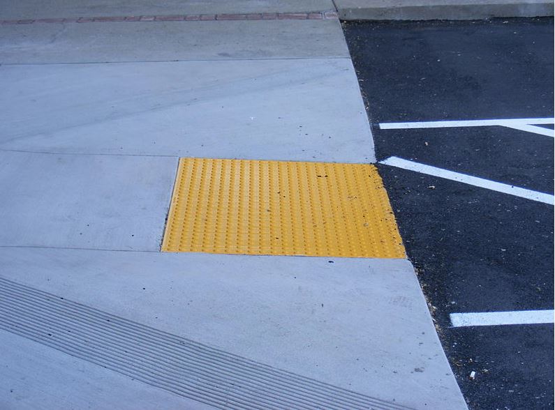 A rumble strip on a sidewalk. This is one accessibility improvement that can be made to sidewalks in eastern kentucky