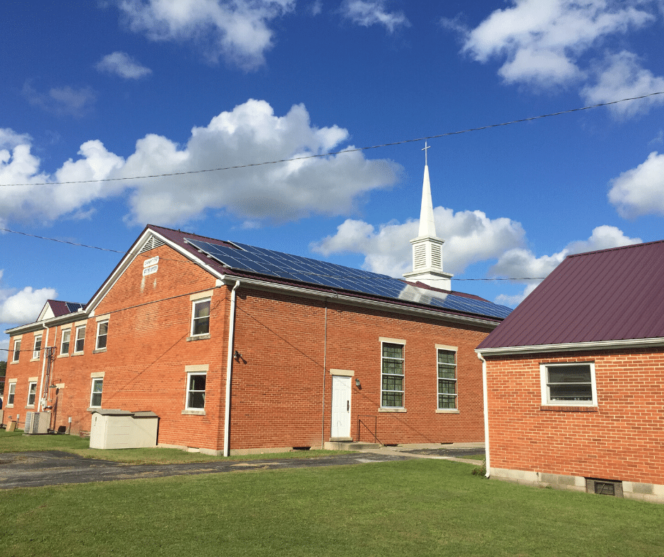 The solar panels glint on the side of Campton Baptist Church in Eastern Kentucky. Many churches go solar with MACED's support