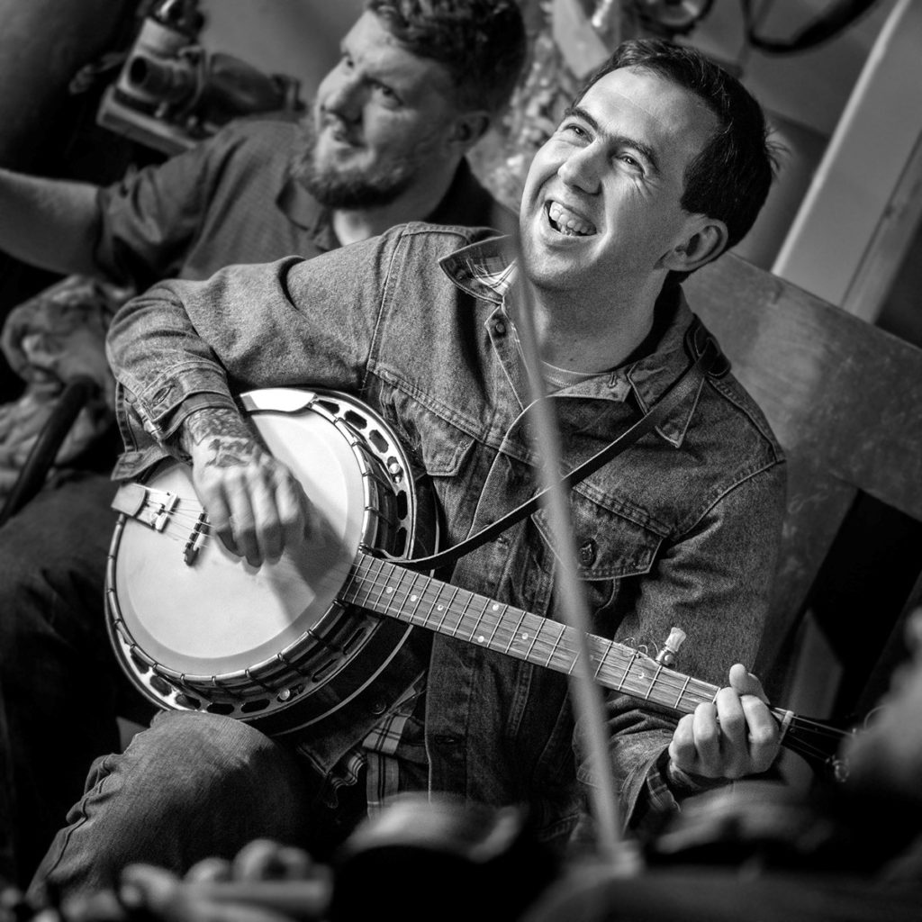 John Haymood smiles as he plays banjo at a festival for mountain music in whitesburg, kentucky. Photo by malcolm wilson appalachia