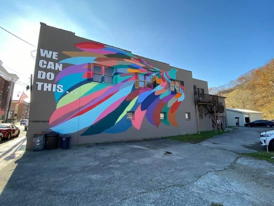 A peacock is painted on a wall in downtown Hazard as a part of a new mural project promoting togetherness.