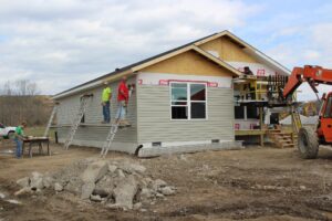 Housing development alliance crew builds a home post-flood