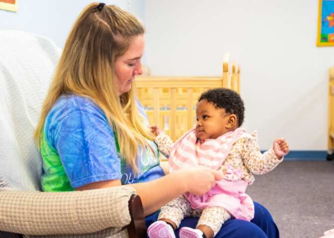 A New Beginnings staff member with a little one. The East Kentucky Child Care Coalition is working to support facilities like this one