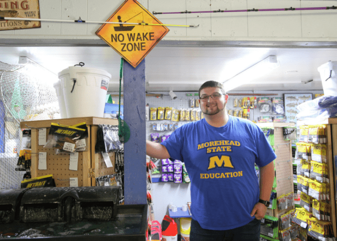 Business owner stands inside his bait and tackle shop in eastern kentucky. Anglers bait-n-tackle is near jenny wiley state resort park