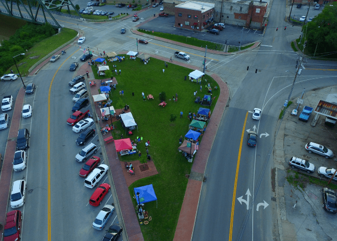 An aerial view of cars and tents at a summer festival in eastern kentucky. thursdays on the triangle is a popular event in hazard