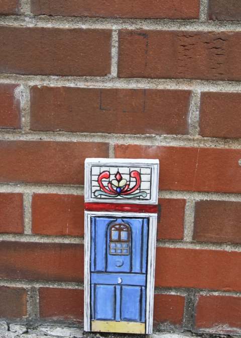 A tiny door on Main Street in Hazard. This is part of revitalizing the small eastern kentucky town that boomed during the coal height