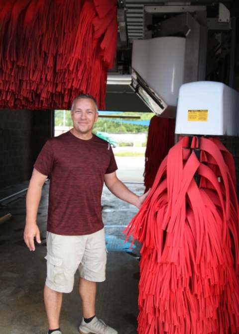 Willie Crase stands next to his car wash machine in Martin, kentucky. The eastern kentucky owner owns multiple businesses in floyd county