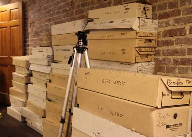 Boxes of photos sit in the WSGS studio space waiting to be sorted as part of their perry county and eastern kentucky archiving history project.