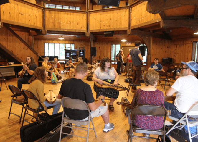 A crowd of students inside Cowan COmmunity Center in Letcher County, kentucky during music lessons at Cowan Music School