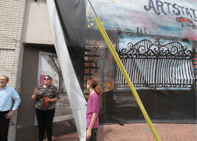 Downtown coordination, bailey Richards, leads a walking tour of downtown hazard, kentucky, in perry county. 