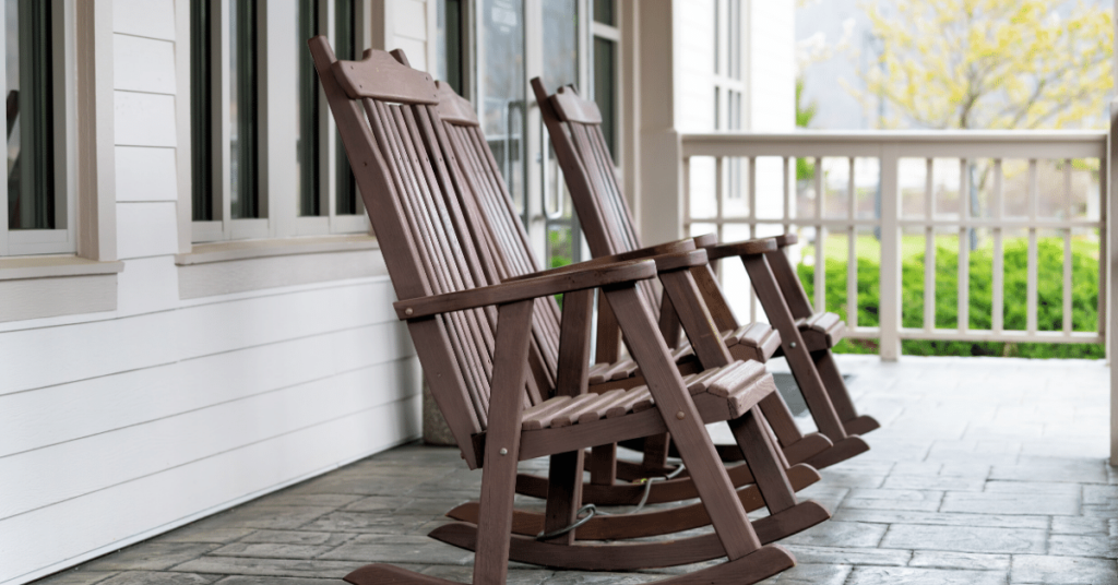 Rocking chairs sit on a front porch at an airbnb in eastern kentucky.