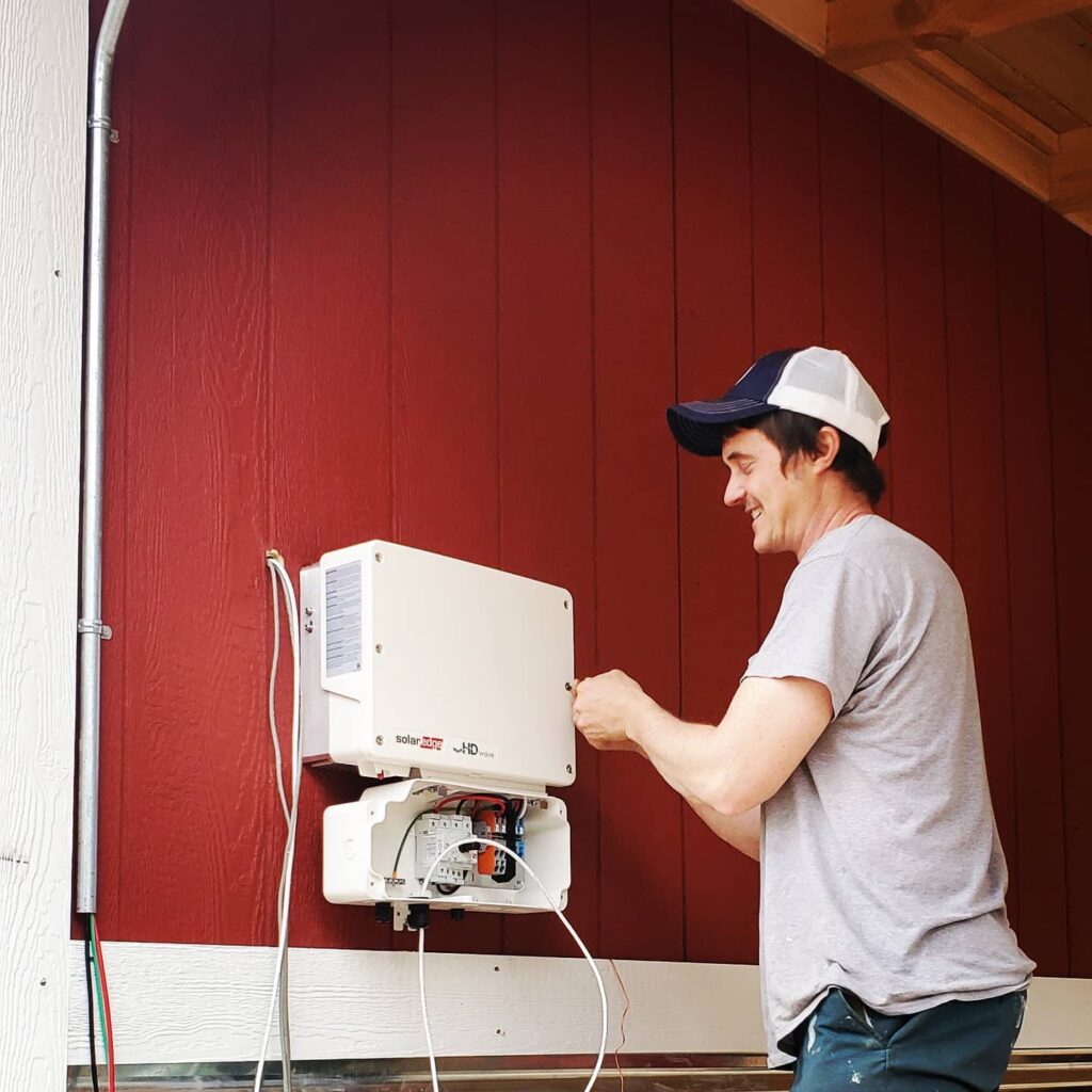 ben tatum with appalachian energyworks installs solar at homegrown hideaways in berea, kentucky.