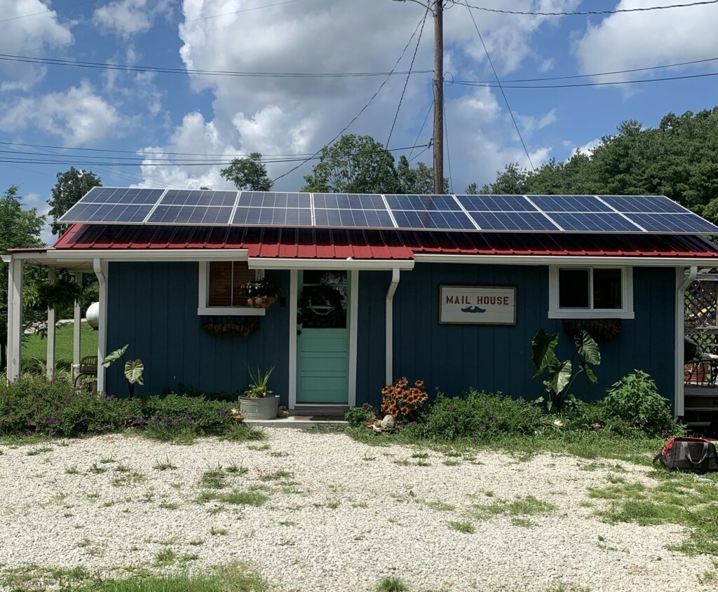 Solar panels cover the roof of the mail house airbnb