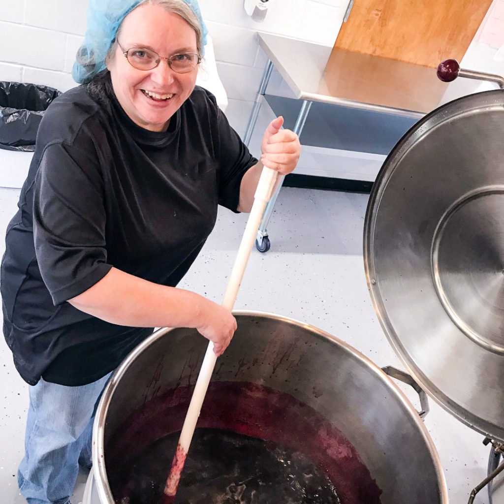 An Eastern Kentucky entrepreneur working at CANE Kitchen in Whitesburg. MACED supports Appalachian local food systems