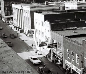 An old photo of main street showing the new temperature and time sign installed in the 1960s