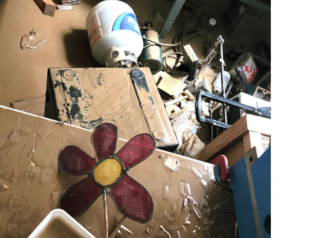 An image of studio equipment covered in mud and water