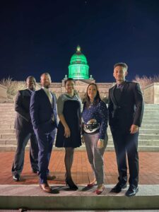 The council stands in front of the Kentucky state capitol building