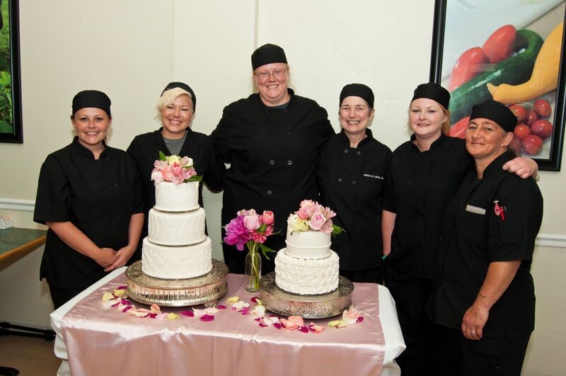 Students of Fruits of Labor stand with decorated cakes in Rainelle, West Virginia. Students are risk youth and women in recovery. They receive training in culinary arts and agriculture. 