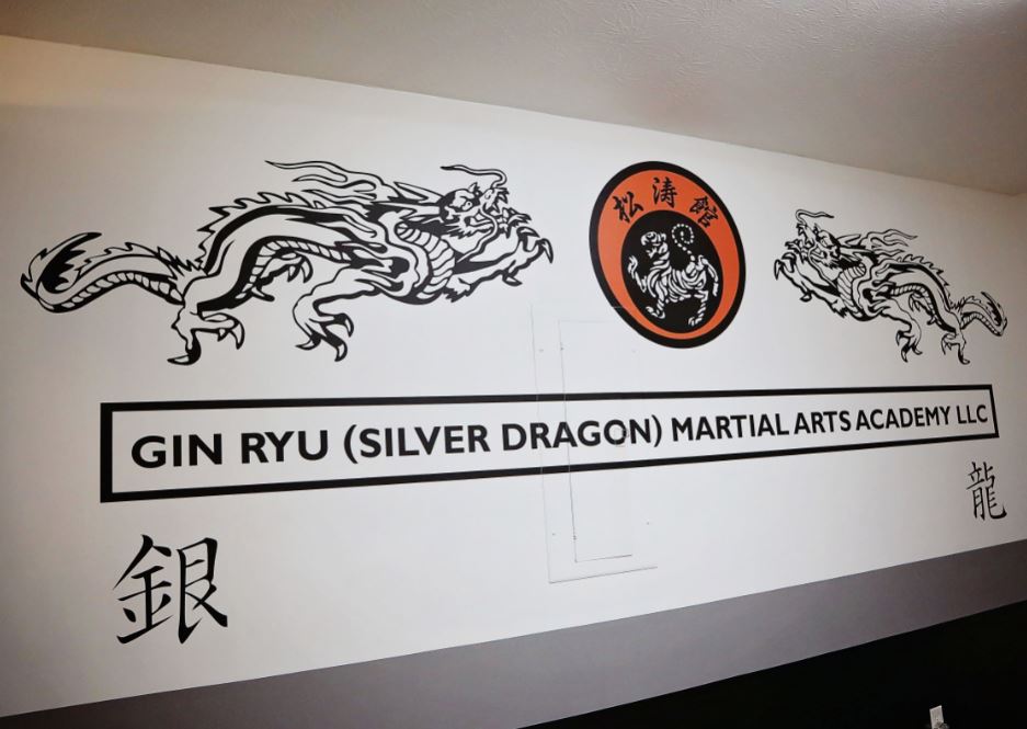 The decal on the wall at Gin Ryu Martial Arts Academy, a traditional karate school. The Eastern Kentucky business is supported by MACED