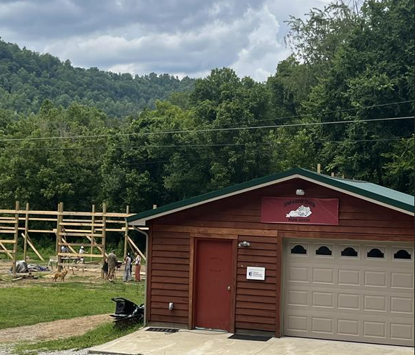 The existing food pantry building in front of the new expanded building that is under construction