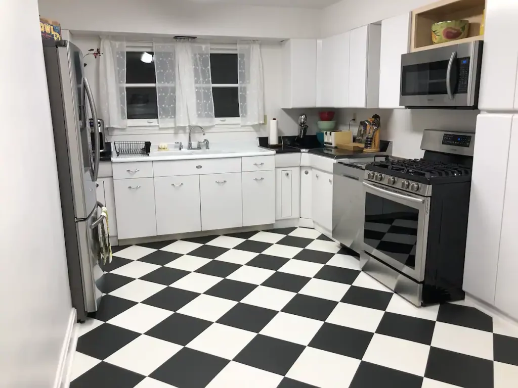 A kitchen with black and white tile at an airbnb in Clay County kentucky.