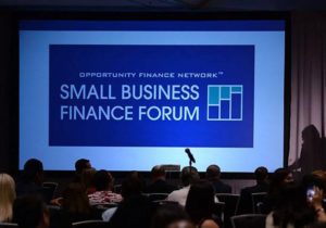 A screen during the small business finance forum. MACED attends to learn more about supporting entrepreneurs