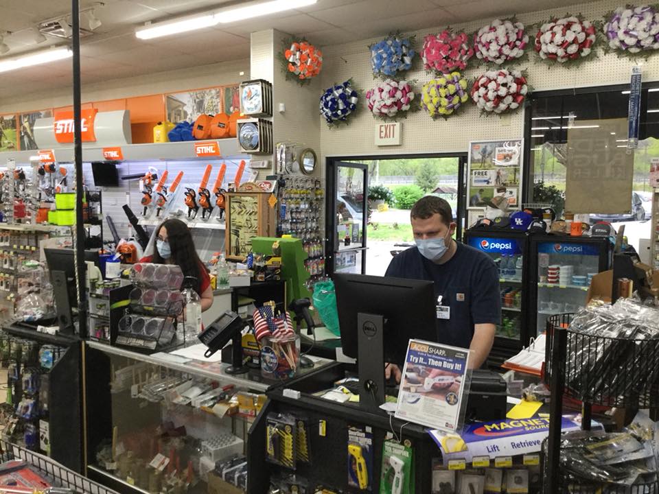 Long's One & Up Hardware employees wear masks during COVID-19. The Pineville, Kentucky, store will be solar powered.