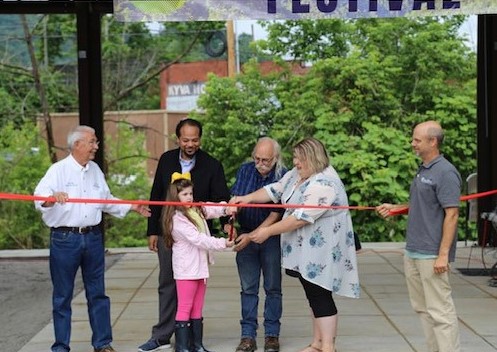 a ribbon cutting held at a renewable energy unveil in eastern kentucky. MACED supports solar in appalachia through financing and more