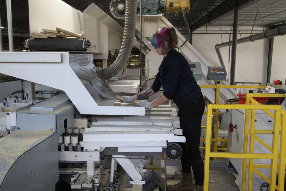 An employee at Powell Valley Millwork works some of the machinery. They are the second largest employer in Powell County 