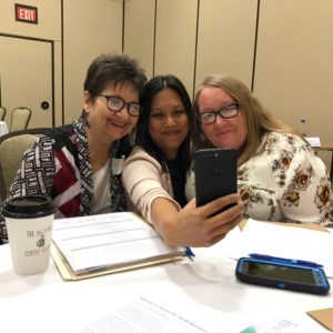 Three women take a selfie at an event in eastern kentucky for women entrepreneurs and business owners.