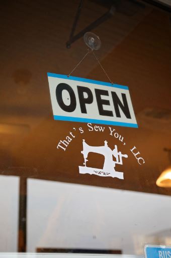 The decal on the window of That’s Sew You quilt shop in Stanton, Kentucky. The shop is supported by MACED's business financing