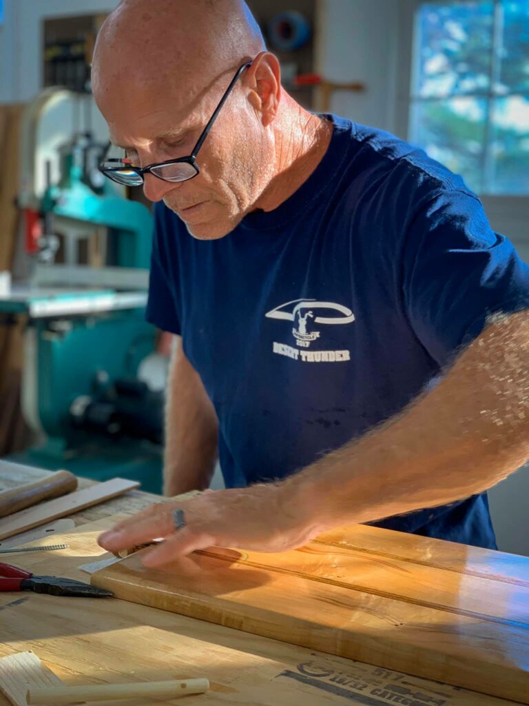 Tom Eidschun works on a wood working project.